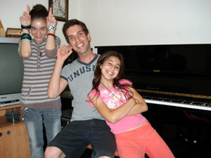 An image of me (David Your piano teacher) with Noam and Ariel, two of my students.)